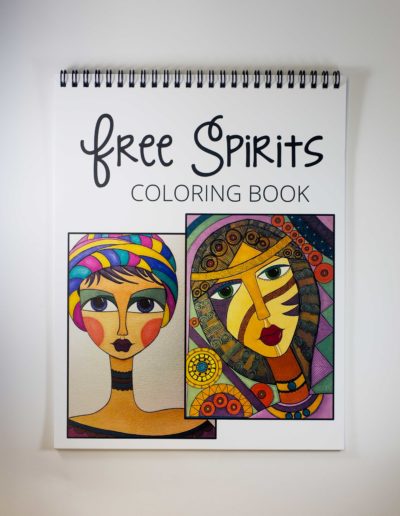 Coloring book with the words "Free Spirits Coloring Book" at the top and two abstract portraits of women.